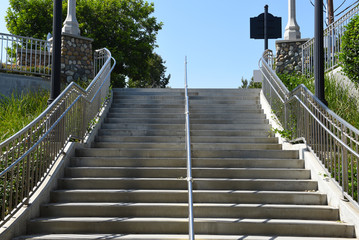 Stairs at the Orange Train Station, leading to the underpass that connects the northbound and...