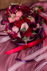 Bridal bouquet of roses, callas and orchids