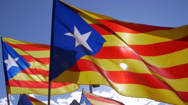 Catalan Flags waving against the blue sky. Catalonia country wants the independence from Spain