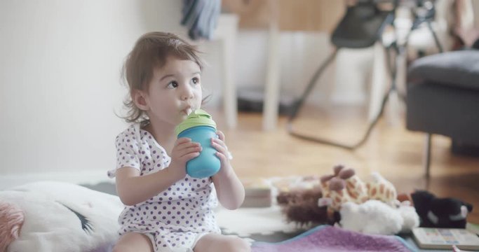Cute 1-year old toddler girl at home. Shot in 4K RAW on a cinema camera.
