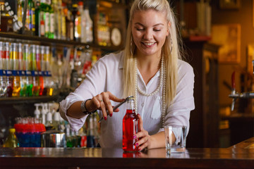 Woman working at the bar counter
