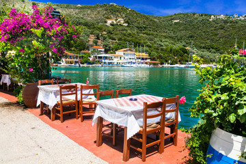 Fototapeta na wymiar Traditional Greek restaurants near the sea. Sivota fishing village in Lefkada island