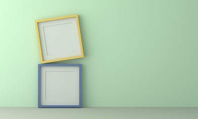 two colorful picture frame for insert text or image inside on pastel light green color wall.