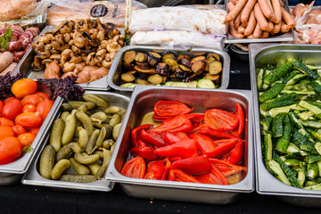 Different vegetables in a metal trays for sale in street shop