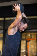 fit man throwing medicine ball