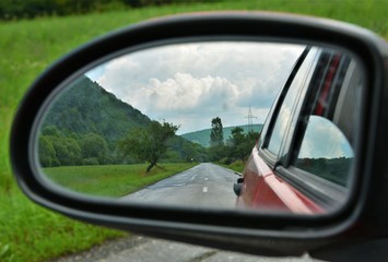Fototapeta premium landscape seen through the rearview