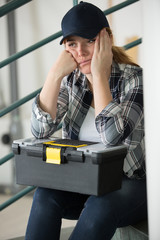 beautiful tired sad young woman in plaid shirt