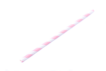 Closeup of drinking straw for party.  White with pink spiral. Top view of colorful disposable eco-friendly straw for summer cocktails. Paper coctail colorful straw on white  background, isolated.
