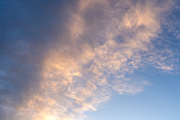 Dramatic morning evening sky blue orange dark horizontal diagonal clouds