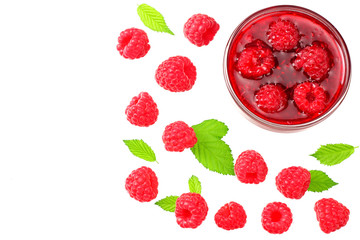 ripe raspberries with green leaves and jam isolated on white background. top view