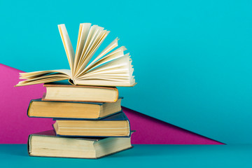 Open book, hardback books on wooden table. Back to school. Copy space