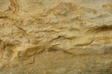 Sand texture, wall with sand, rocks