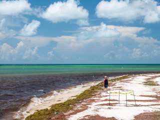 A girl is walking alone at Bahia Honda State Park. Bahia Honda is an island in the lower Florida Keys, USA. Travel and vacation concept.