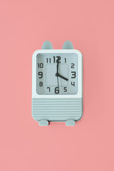 alarm clock on pink background