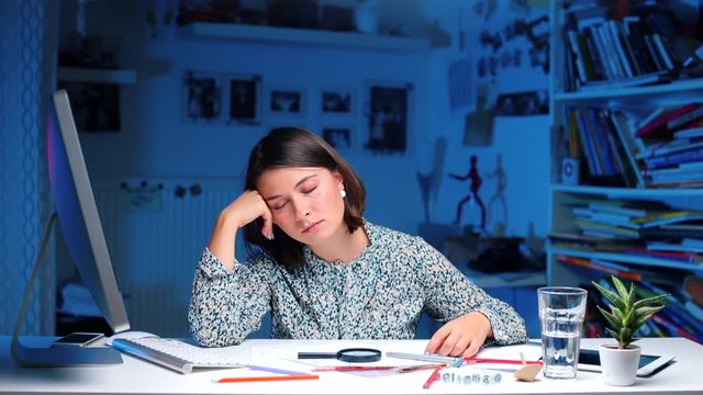 The girl falls asleep during a working day in the office