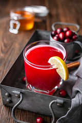 Healthy drink for urinary tract health, homemade cranberry juice with lemon and cinnamon, sweetened with honey