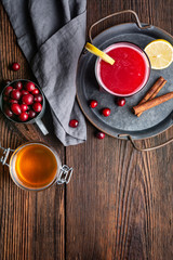 Healthy drink for urinary tract health, homemade cranberry juice with lemon and cinnamon, sweetened with honey with copy space
