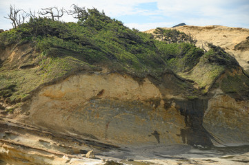 Sandy mountain or rock in the sea or ocean. Landscape, beautiful views.