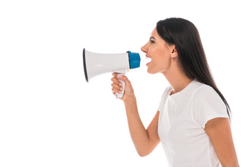 Naklejka premium side view of angry woman screaming in megaphone isolated on white