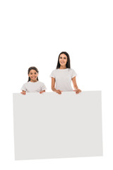 happy mother and daughter standing with placard isolated on white