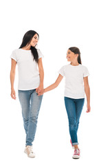 happy mother and daughter holding hands isolated on white