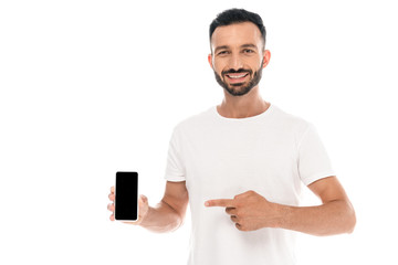 happy man pointing with finger at smartphone with blank screen isolated on white