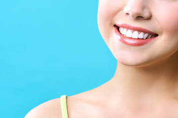 Perfect healthy teeth smile of a young woman. Teeth whitening. Dental clinic patient. Image symbolizes oral care dentistry, stomatology.