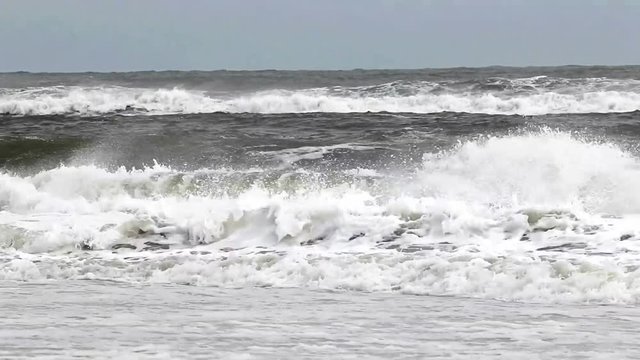 Ocean waves during an October tropical storm arre very rough and extreme off of the coast of Long Island New York