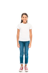 Fototapeta premium happy kid in blue jeans standing isolated on white