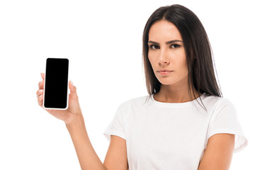 displeased woman holding smartphone with blank screen isolated on white
