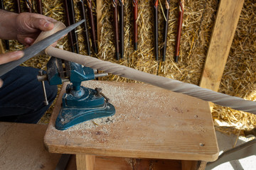Man doing wooden walking stick with hands