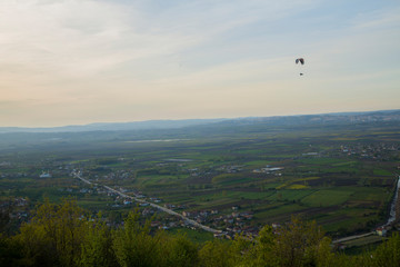 parachute flying over the village