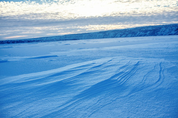 Fototapeta na wymiar winter nature with blue snowdrifts