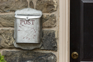 metal mailbox old stone wall