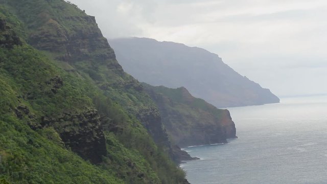 Coast view in the mountains Hawaii Kauai napali trail during rain storm 