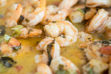 Close up of pan cooked shrimp with parsley