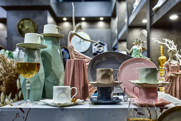 a showcase with the laying of porcelain dishes. Beautiful merchandising, dishes for restaurants and hotels