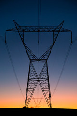 high voltage lines on background of blue sky