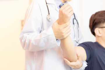 Close up of Physiotherapist working with patient in clinic