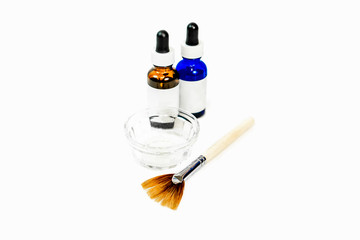 Blue and brown eye dropper bottles for cosmetic chemical peel formula, with dish and applicator...