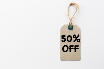 Paper label with rope on white background. Sale in modern design. Minimal concept. Flat lay, top view, mockup, template, copy space for text, overhead