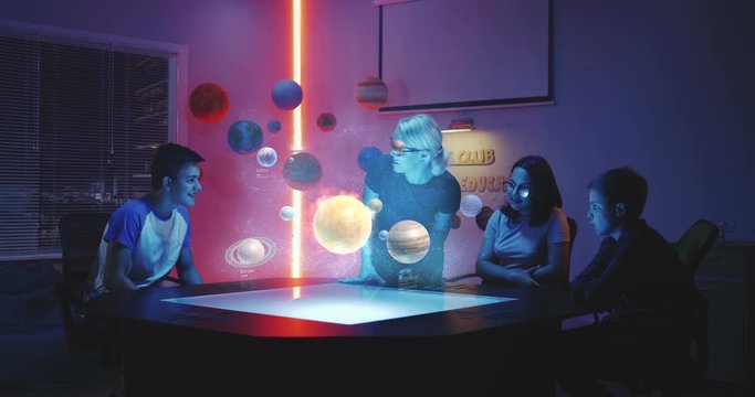 Teacher giving a class with holographic solar system