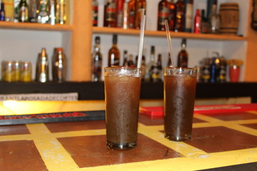 Two glasses of iced tea in a bar