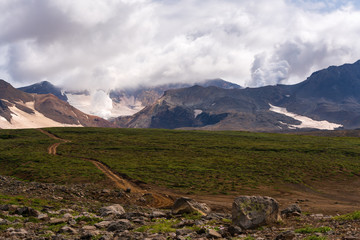 Autumn volcanic landscape of Kamchatka Peninsula, view of cone active Mutnovsky Volcano geothermal...