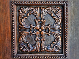 a wooden sculpture with traditional shapes