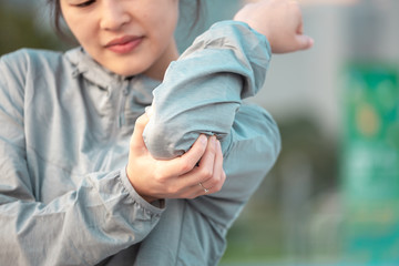 female's elbow pain. Arm injury concept.