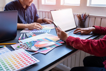 Group of artists brainstorming planning partnership strategy to coworkers in creative office.