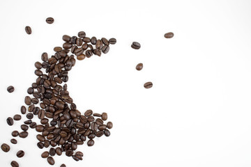Coffee beans on a white background with copy space.
