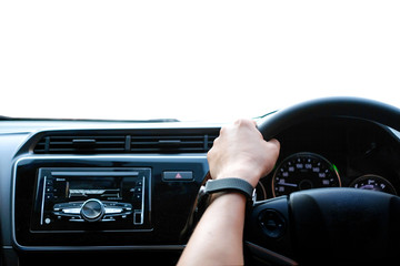 Obraz premium Man sit in the car hand is driving the car on the road. travel to He is looking to a road traffic route and listening to music happily .