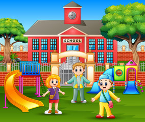 Obraz na płótnie Canvas Happy children playing in front the school